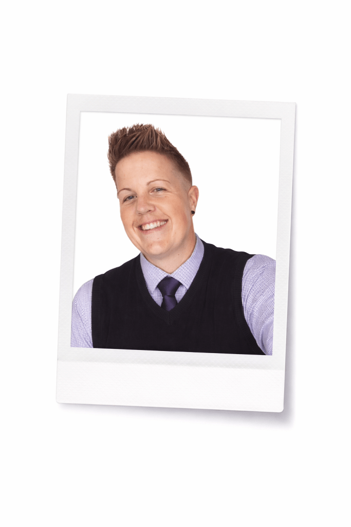 Picture of me in a tie and sweater vest.