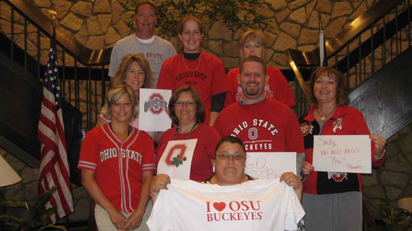 Group of people wearing Ohio State Buckeye shirts.