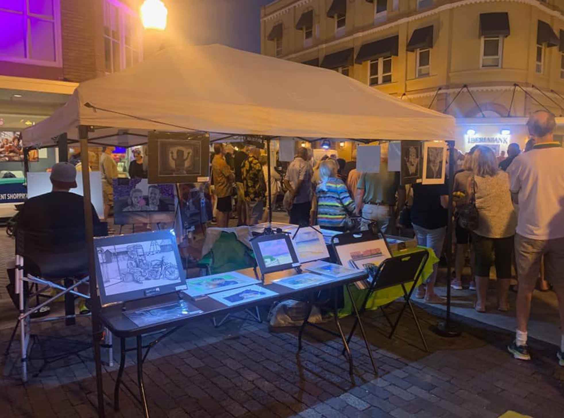 Tent with a table and art on the table.
