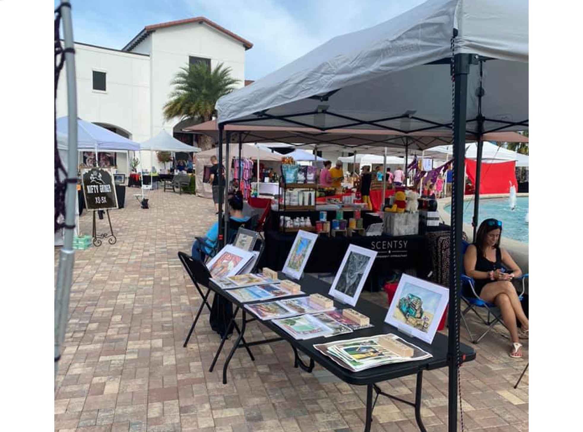 Tent with a table and art on the table.